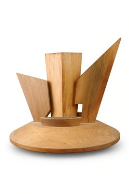 a wooden sculpture of a boat on a wooden stand