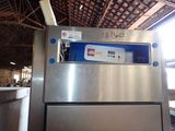 an image of a stainless steel refrigerator inside of a building