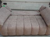 a couch that is sitting on the floor in the garage