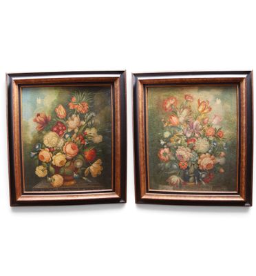 two framed paintings of flowers in a vase on a wall