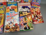 a lot of comic books that are on the table