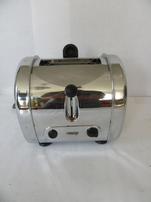 a toaster that is sitting on a white surface