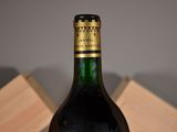 a bottle of wine that is sitting on a table