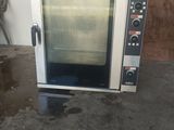 a small oven that is sitting in a room