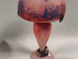 a pink vase with a purple and blue design on it