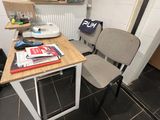 two chairs and a table in a small room