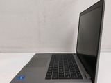 a laptop that is sitting on a white table