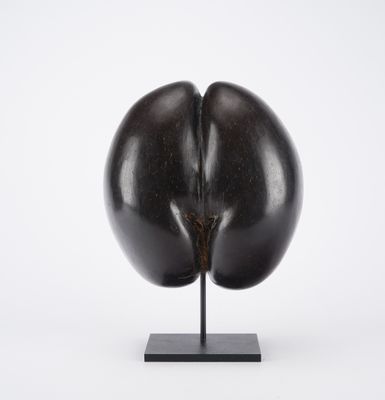 an image of a sculpture of an egg on a stand