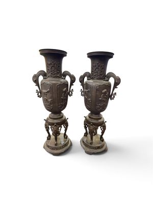 two vases that are sitting next to each other on a table