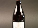 a bottle of wine that is sitting on a table