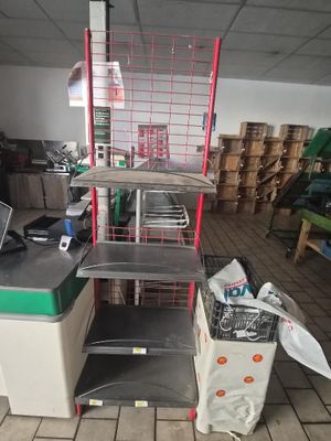 a shelf that has a laptop on it in a room