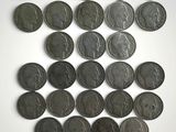 an image of a pile of old coins on a white surface