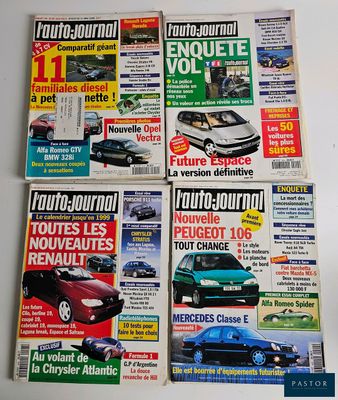 four magazine covers of different cars on display on a table