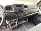 a dashboard of a car with a steering wheel and a control panel
