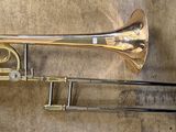 a brass instrument that is laying on the floor