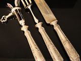 a silverware set with a knife, fork and knife holder