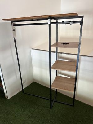 a shelf that has a shelf on it in the corner of a room