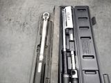 two tools in a case sitting on a table