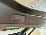 a close up of a car door handle with a button on it