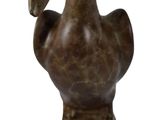 statue of a pelican on a pedestal on a white background