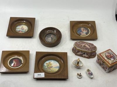 several pieces of art are displayed on a white surface