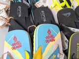 many pairs of flip flops that are on the table