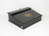 an image of a black box with a gold lion on the lid