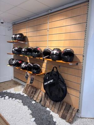 a display of helmets on the wall in a store