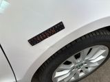 a close up of a sticker on a car ' s bumper