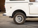 a white truck that is parked in a garage