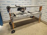 an image of a table with a machine on it in front of a wall
