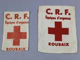 two pieces of cloth with a red cross and a red cross on them