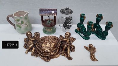a table with a lot of antique items on it
