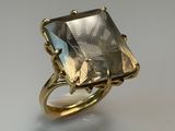 a close up of a gold ring with a large stone in it