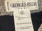 a close up of a label on a black and white jacket