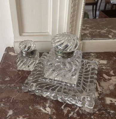 a picture of a glass vanity set on a marble counter top