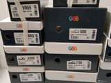 several boxes of different colors and sizes are stacked on top of each other