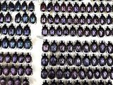 a lot of beetles that are on display in a box
