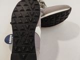 the soles of a pair of shoes on a white surface