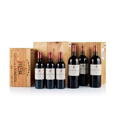 six bouteilles de vin rouge dans un coffret en bois avec un coffret en bois