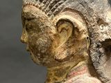 an image of a statue of a woman with a bird on her shoulder