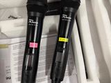 two microphones in the case on the table