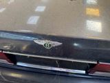 a close up of a car with a badge on it