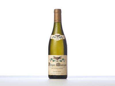 the bottle of white wine is sitting on the table