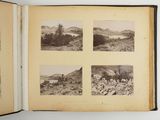 an old photo of a book opened to show pictures of a landscape