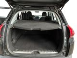 the back of a car with the trunk open and the seats folded down