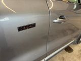 a close up of a car door with a sticker on it