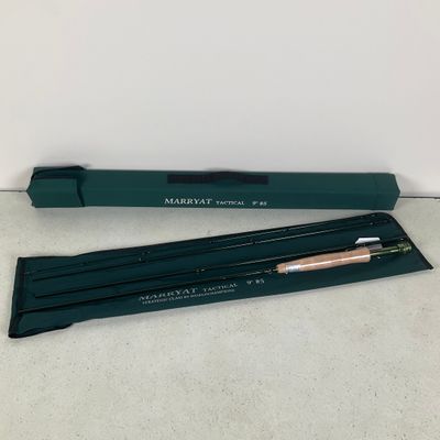 a green pen and pencil set sitting on top of a table