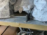 a metal shelf with a bunch of items on top of it