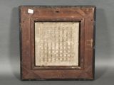 an old picture of a wooden frame with a pattern on it